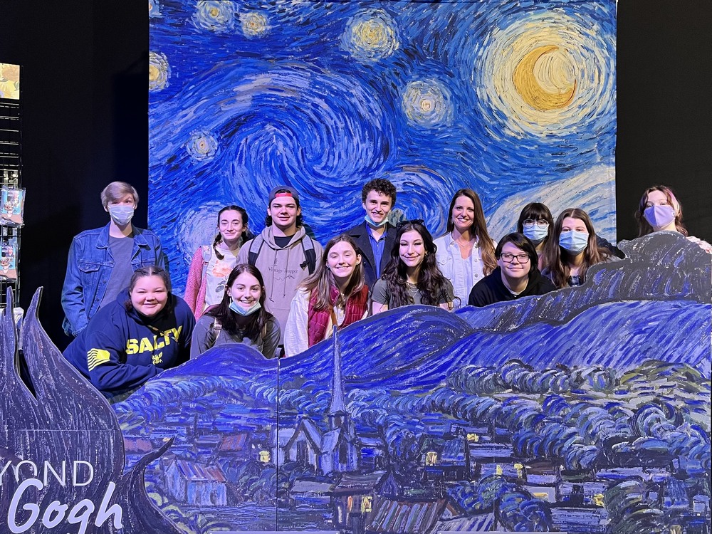 Students posing with the Starry Night