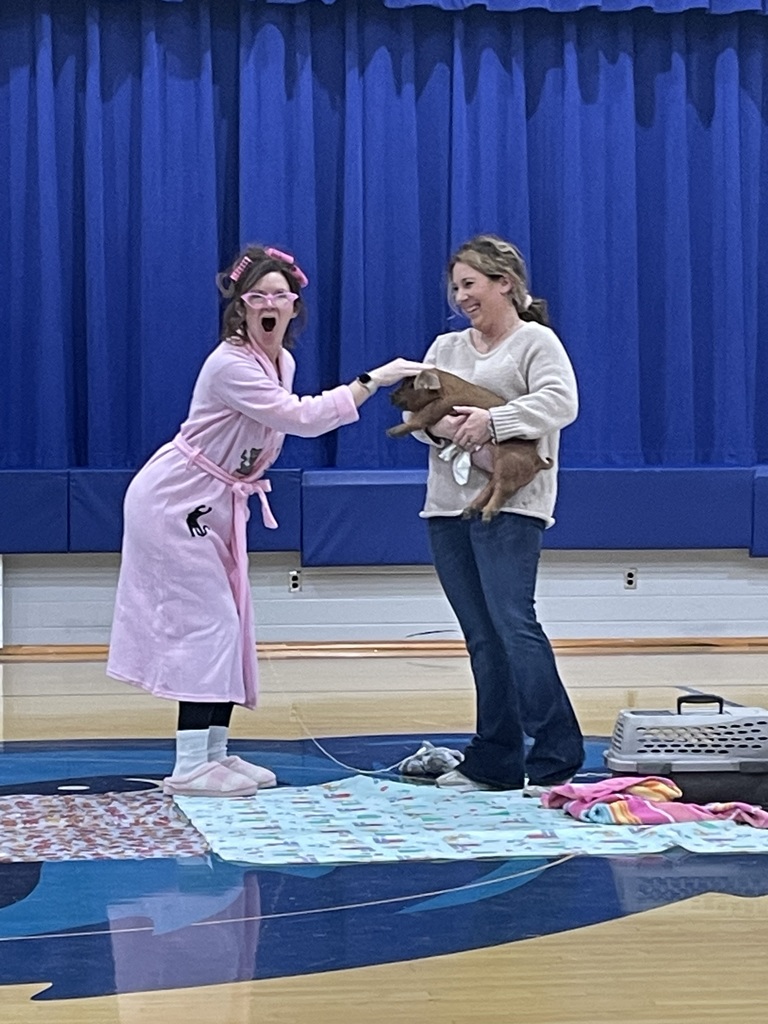 Mrs. Jones kisses the pig